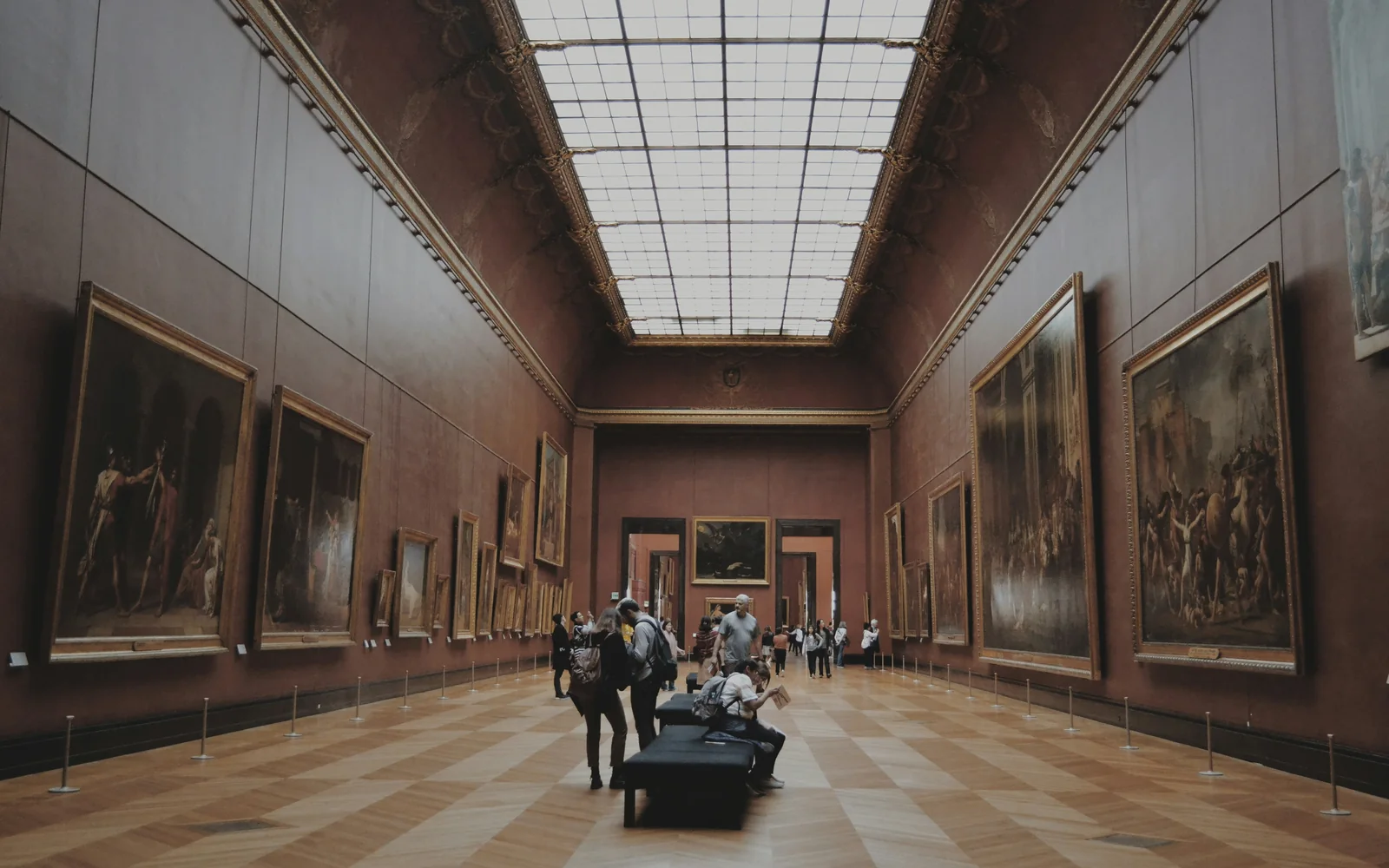 Museum space with visitors using digital tools.