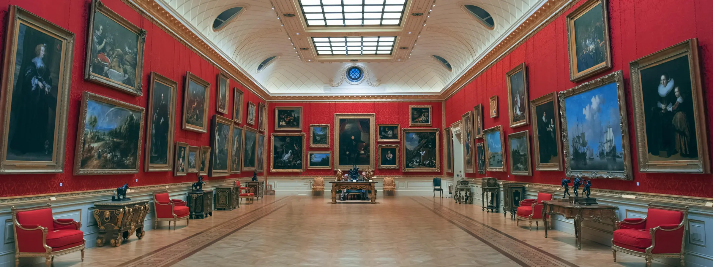 Visitors inside a museum and heritage gallery.